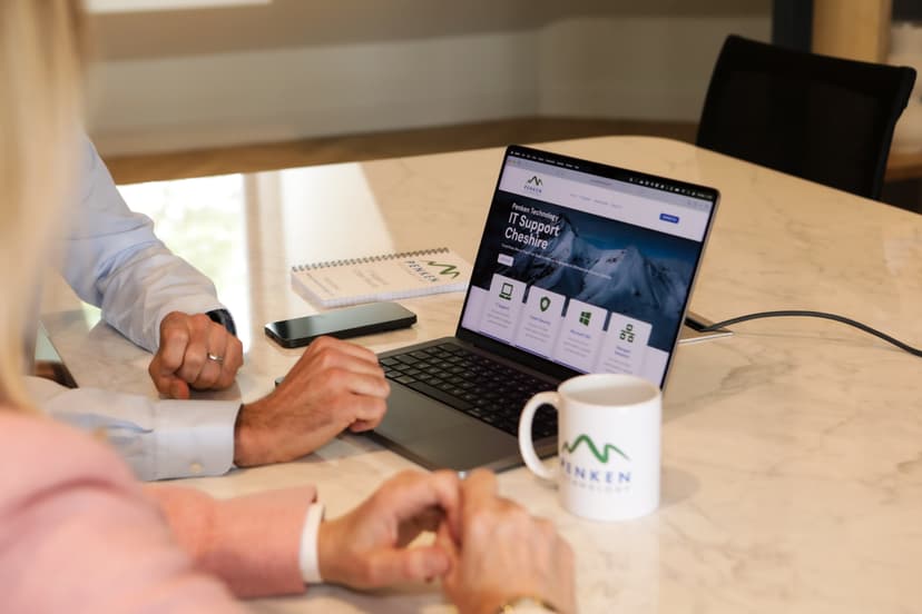 Mark Faulkner chatting with a client over coffee